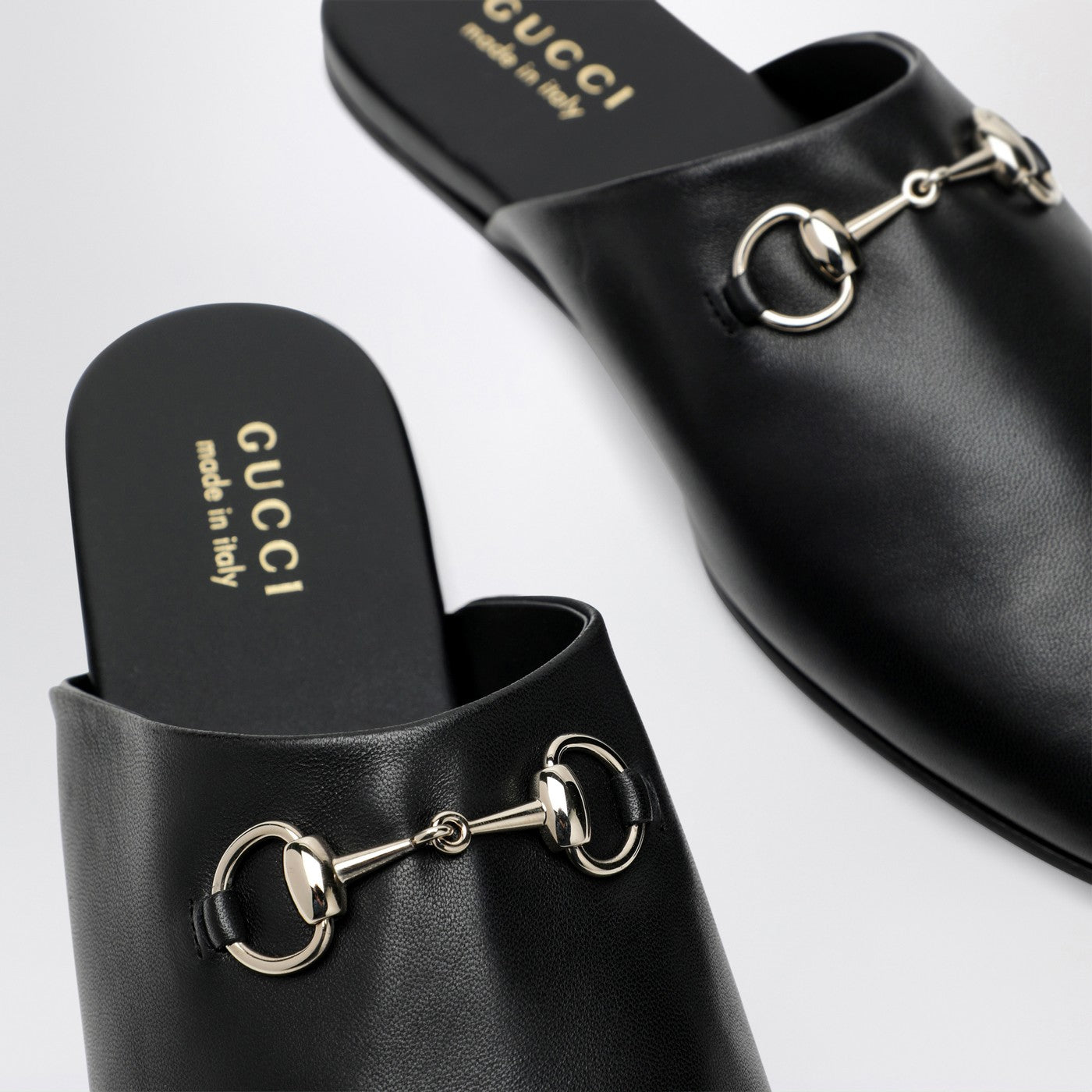 Black leather mules with Horsebit