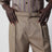High-waisted tailored trousers with belt in beige wool