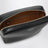 Small black camera bag in hammered leather