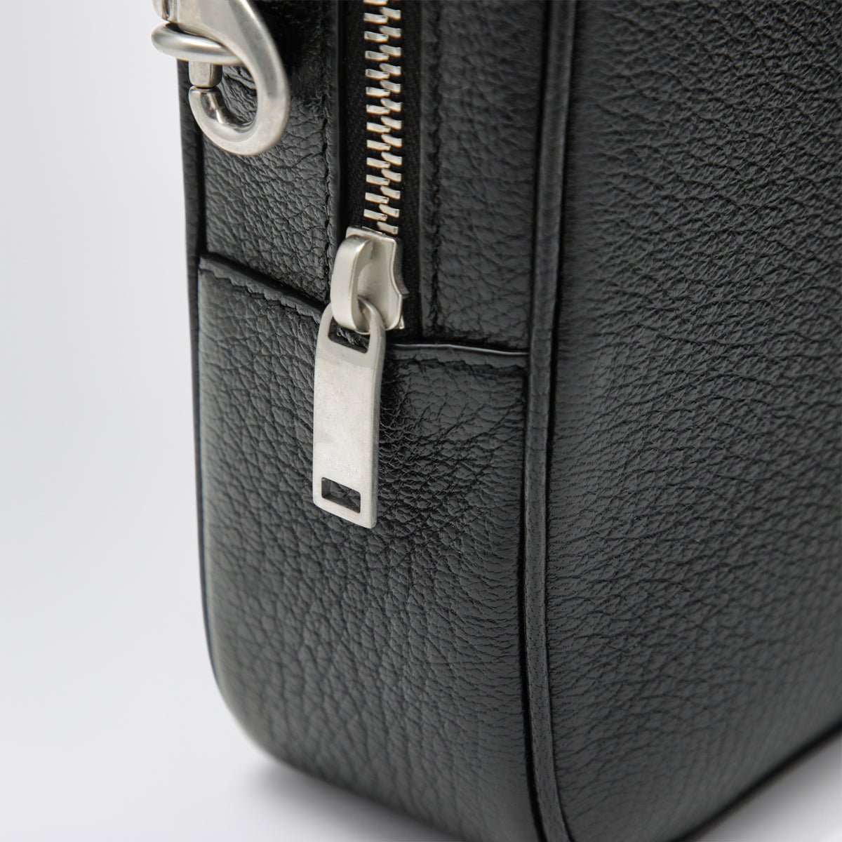 Small black camera bag in hammered leather