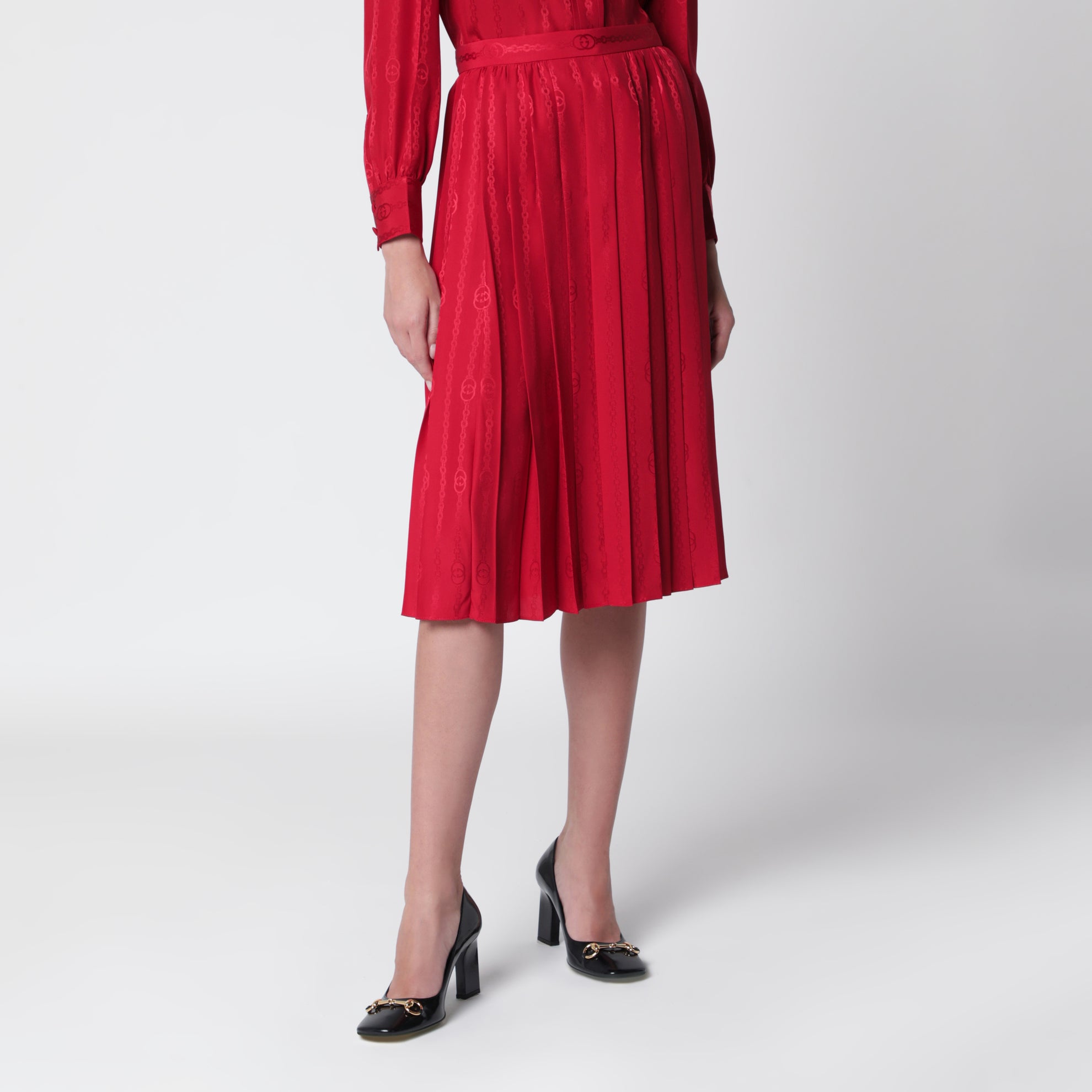 Gonna midi plissettata in seta jacquard rosso fuoco
