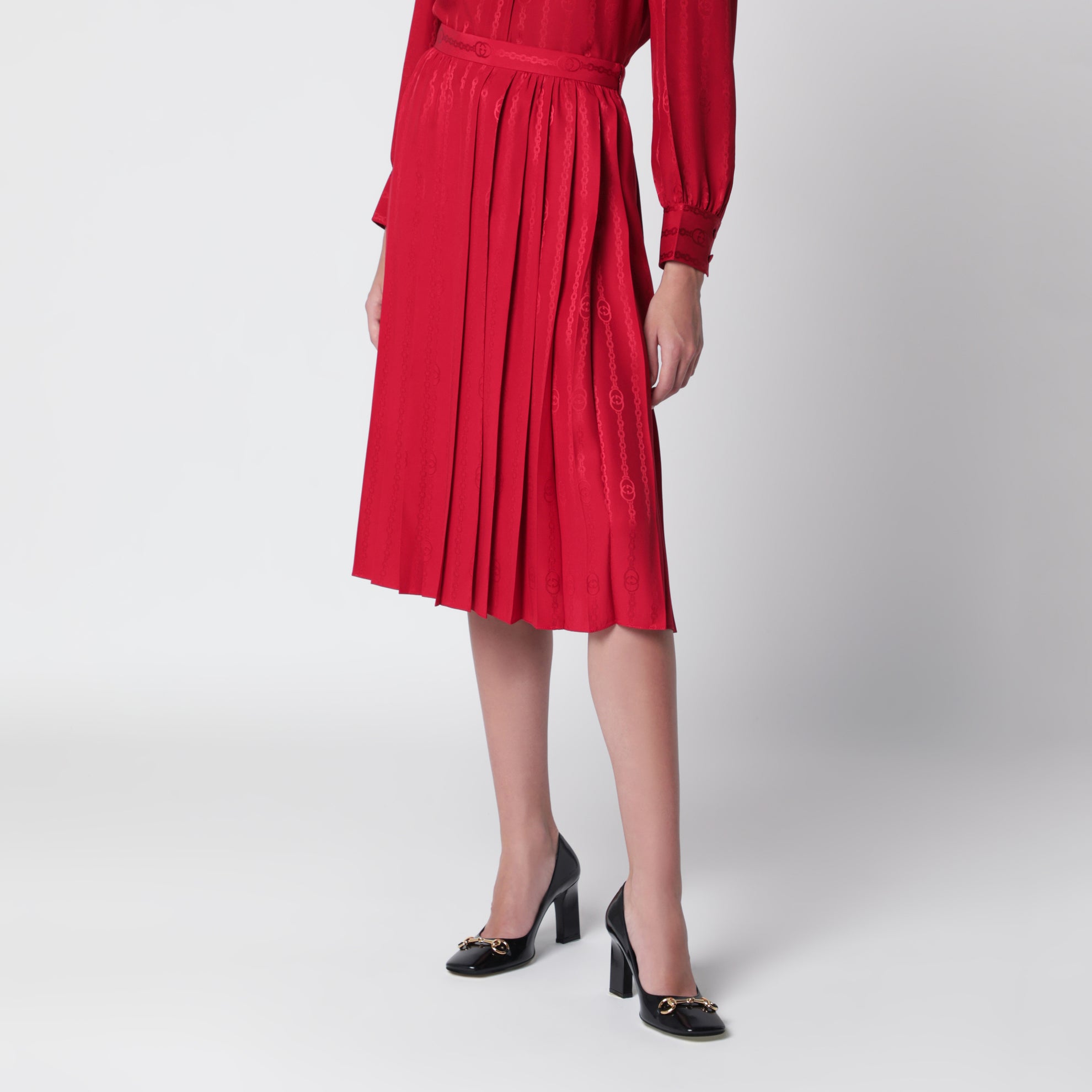 Gonna midi plissettata in seta jacquard rosso fuoco