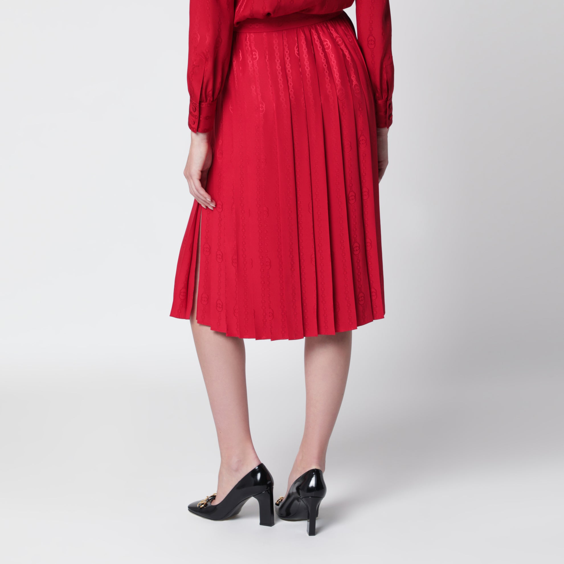Gonna midi plissettata in seta jacquard rosso fuoco