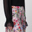 Midi-Faltenrock aus Seide mit Flora-Print in Rosa