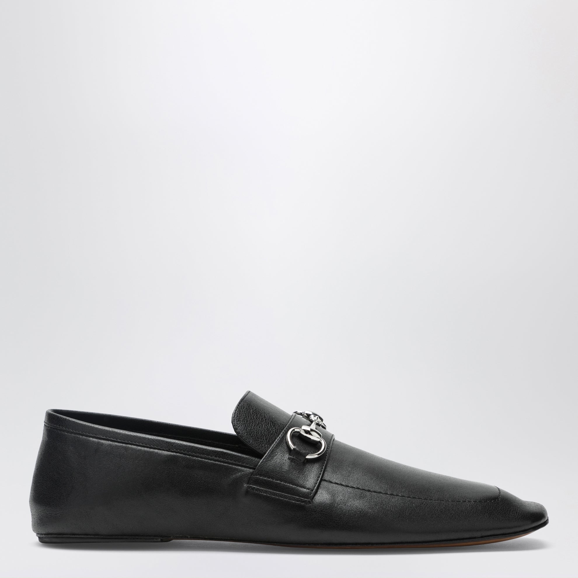 Black leather horsebit loafers with silver hardware