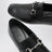 Black leather horsebit loafers with silver hardware