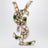 Cassandre-Brosche mit Kristallen aus Messing in Gold