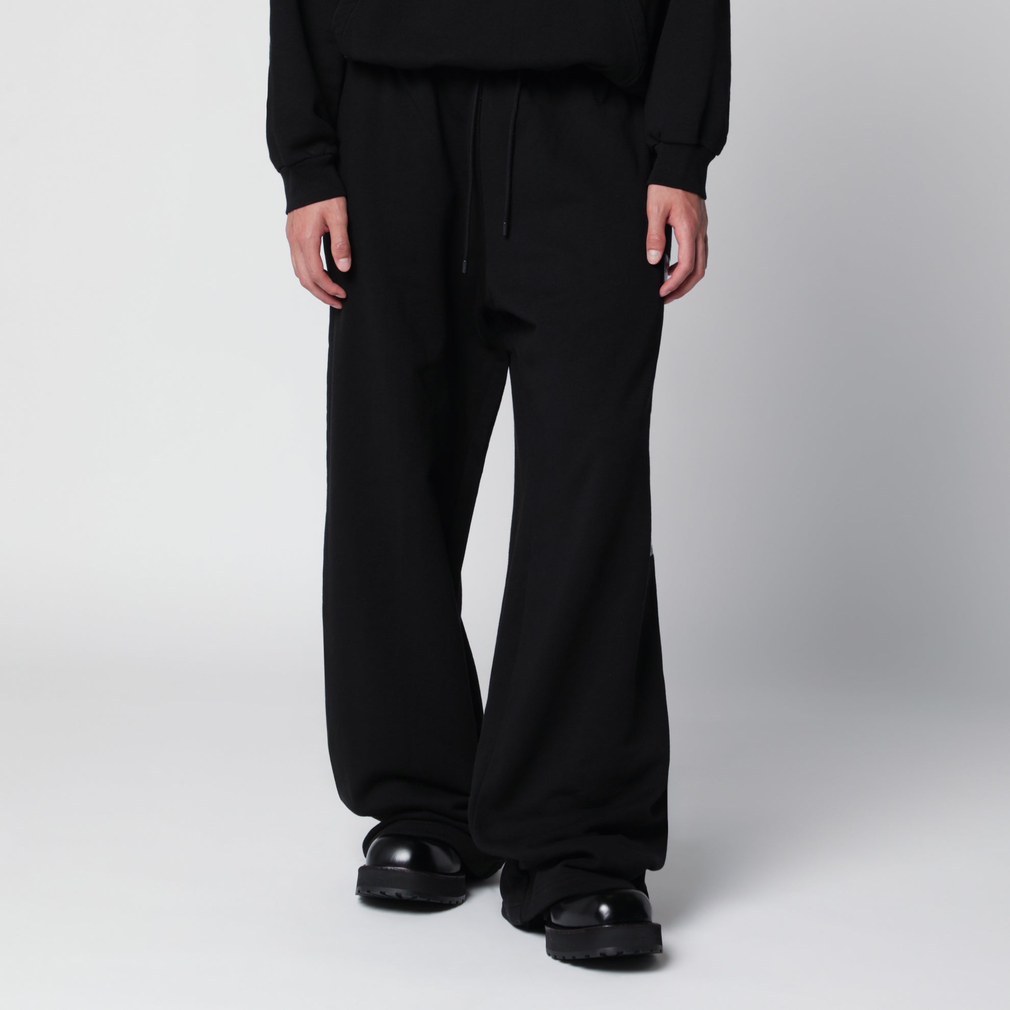 Black jogger trousers with logo print