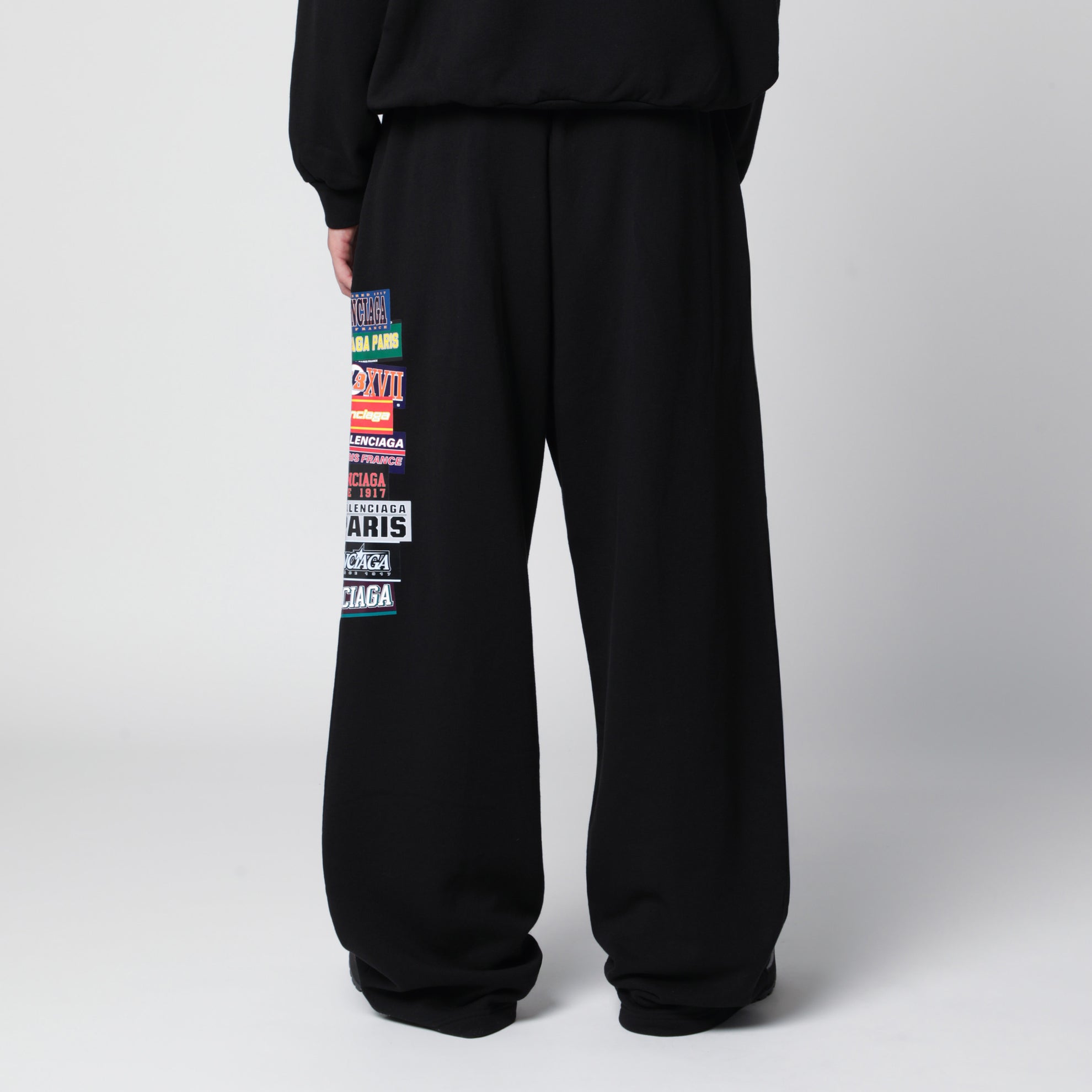 Black jogger trousers with logo print