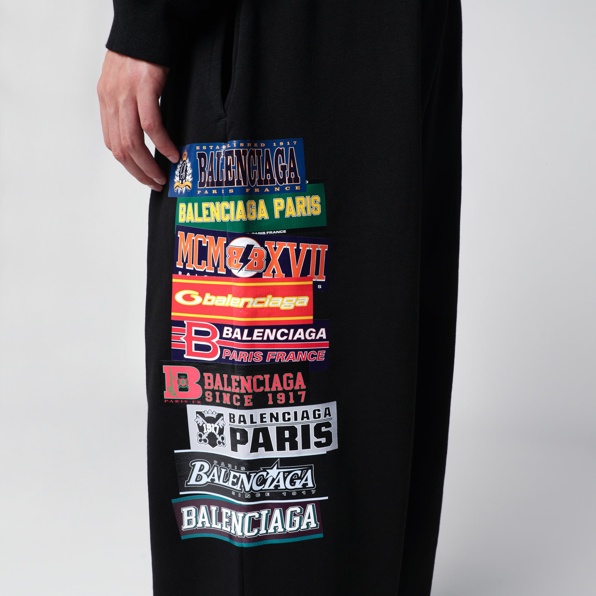 Black jogger trousers with logo print