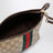 Kleine Pouch aus sandbeigem GG-Gewebe mit Web-Streifen