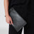 Pochette media Gucci Essence Classic in tela rivestita GG nera