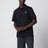 Black polo shirt with logo patch