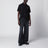 Black polo shirt with logo patch