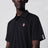 Black polo shirt with logo patch