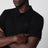 Polo noir en piqué de coton avec patch logo