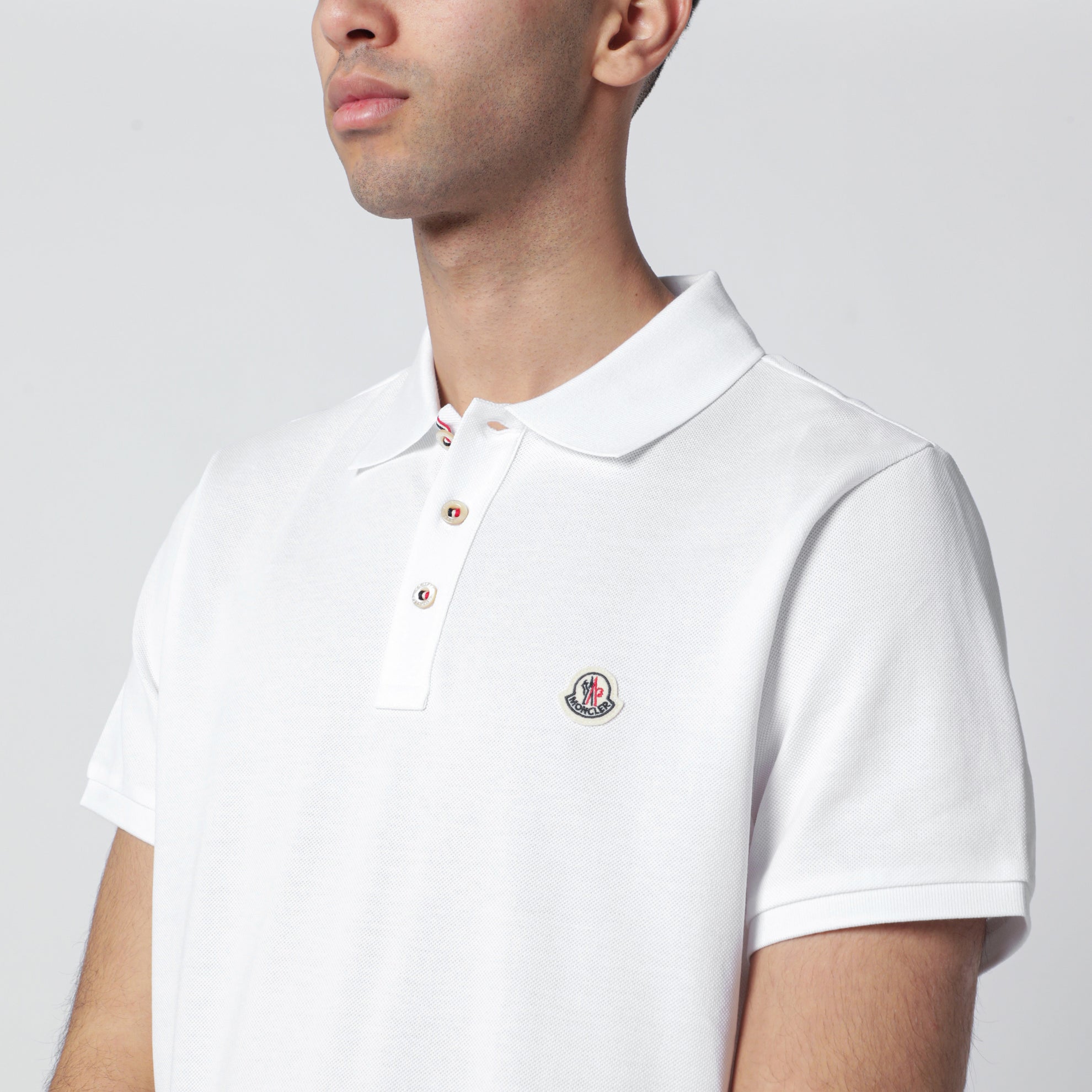Polo in cotone bianca con patch logato