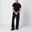 Polo in cotone nera con patch logato