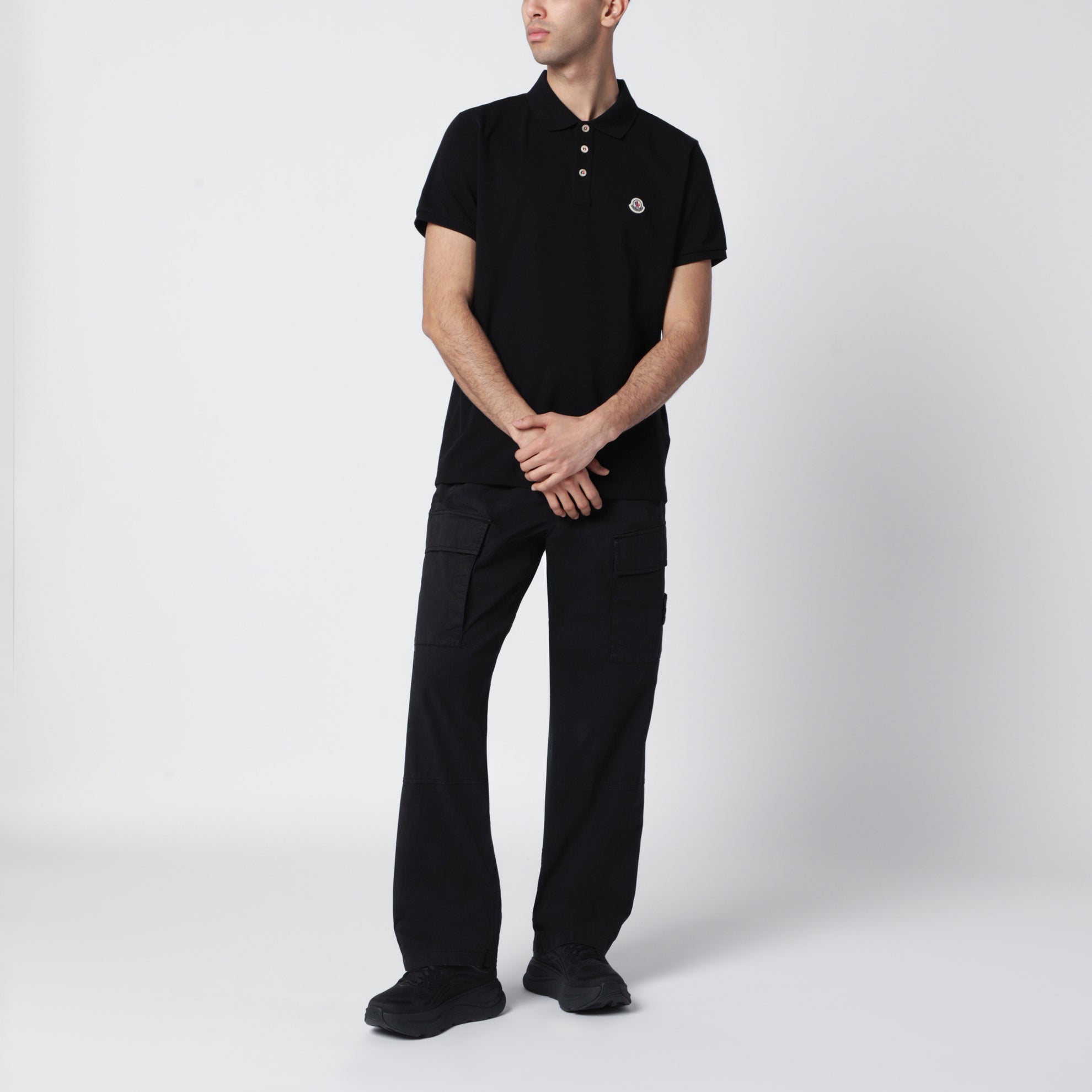 Polo in cotone nera con patch logato