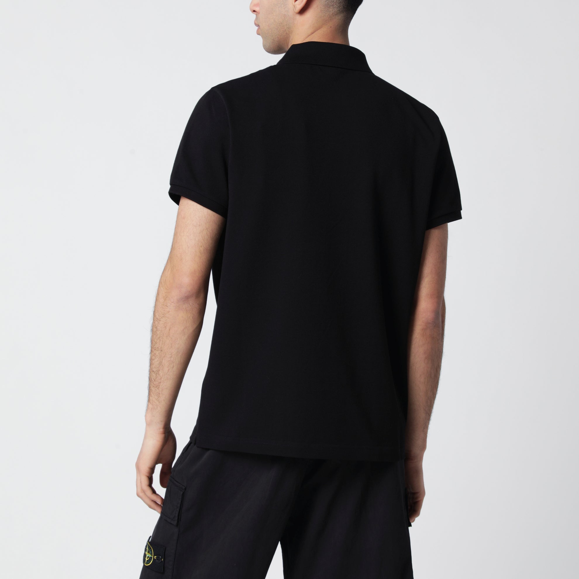 Polo in cotone nera con patch logato