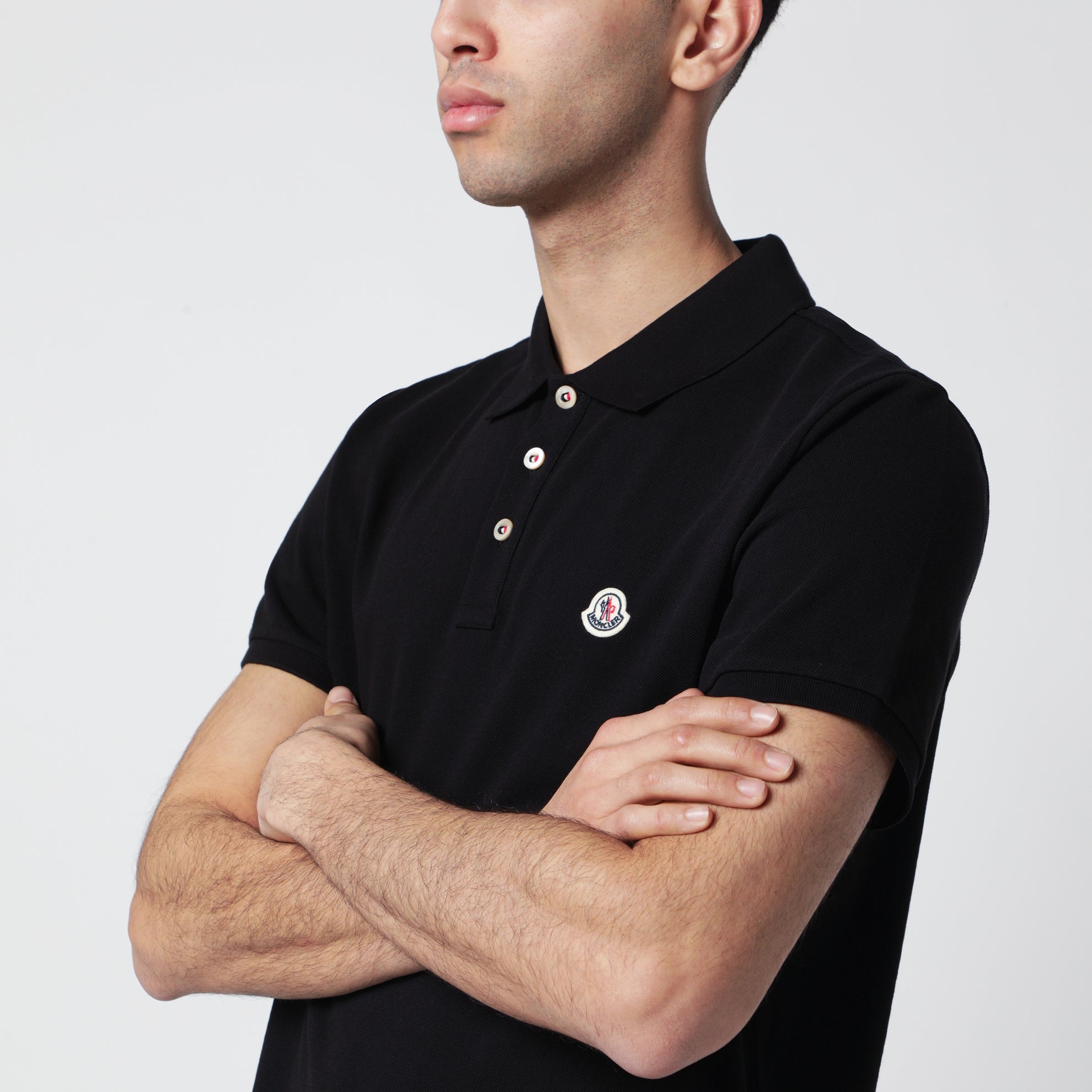 Polo in cotone nera con patch logato