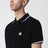 Polo nera in cotone con patch logo