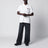 Polo bianca in cotone con patch tre stemmi logo