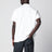 Polo bianca in cotone con patch tre stemmi logo
