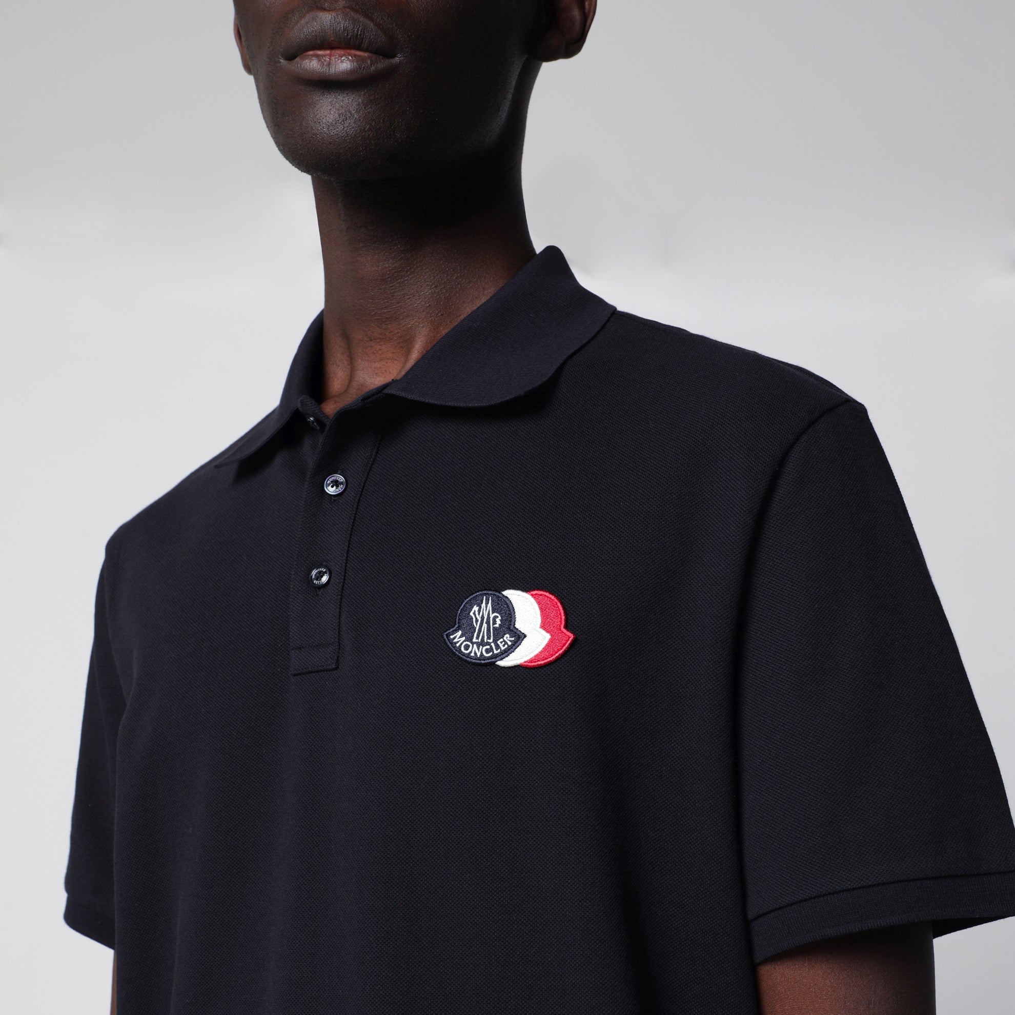 Polo bleu en coton avec patch logo triple blason