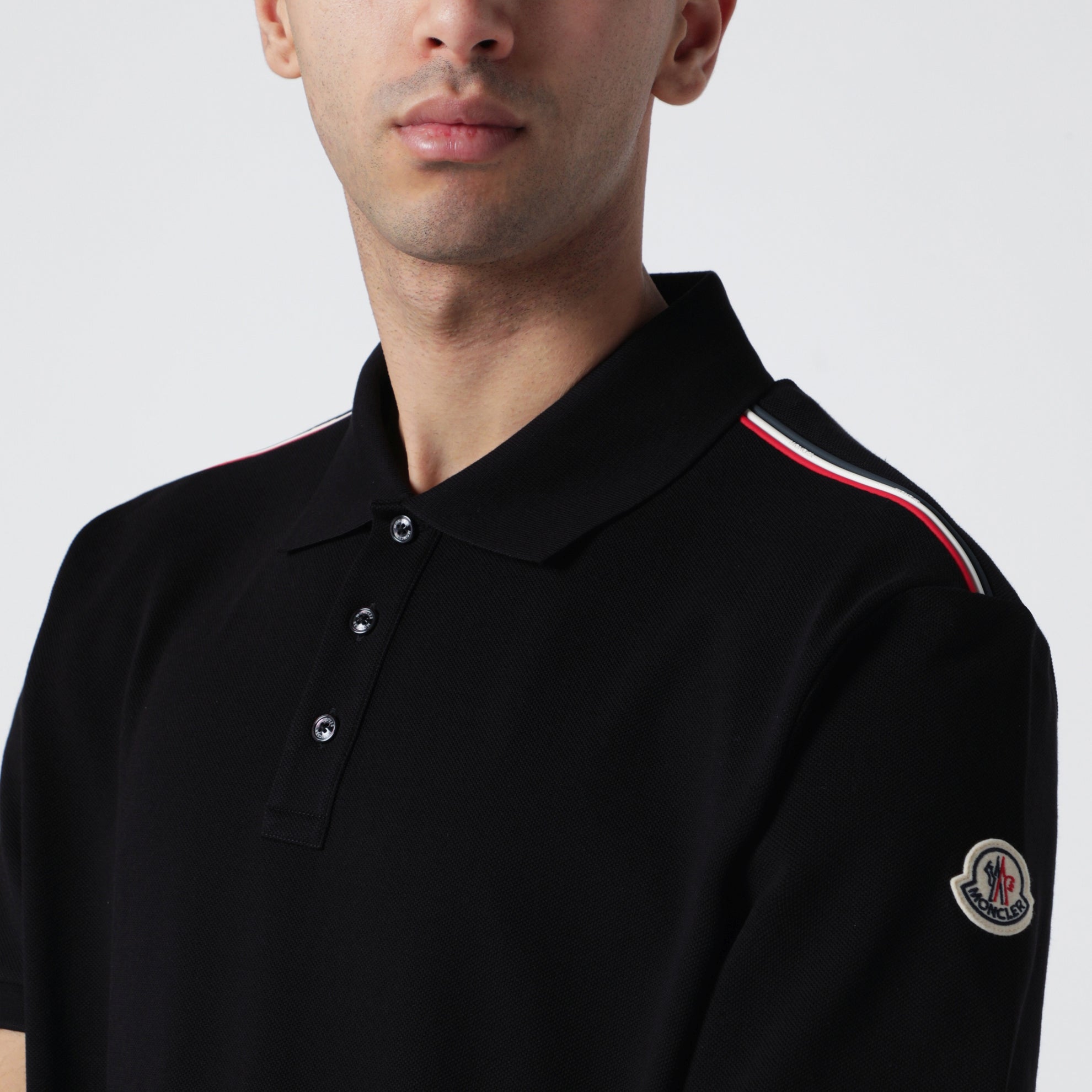 Polo in piqué di cotone nera con bordi tricolori