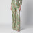 Silk trousers with all-over print in green