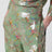 Silk trousers with all-over print in green