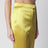 Avocado-colored trousers in shiny silk blend