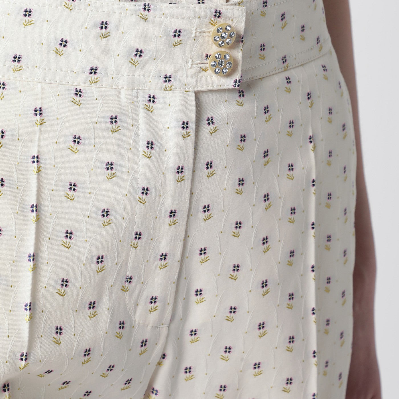 Ivory trousers with floral pattern
