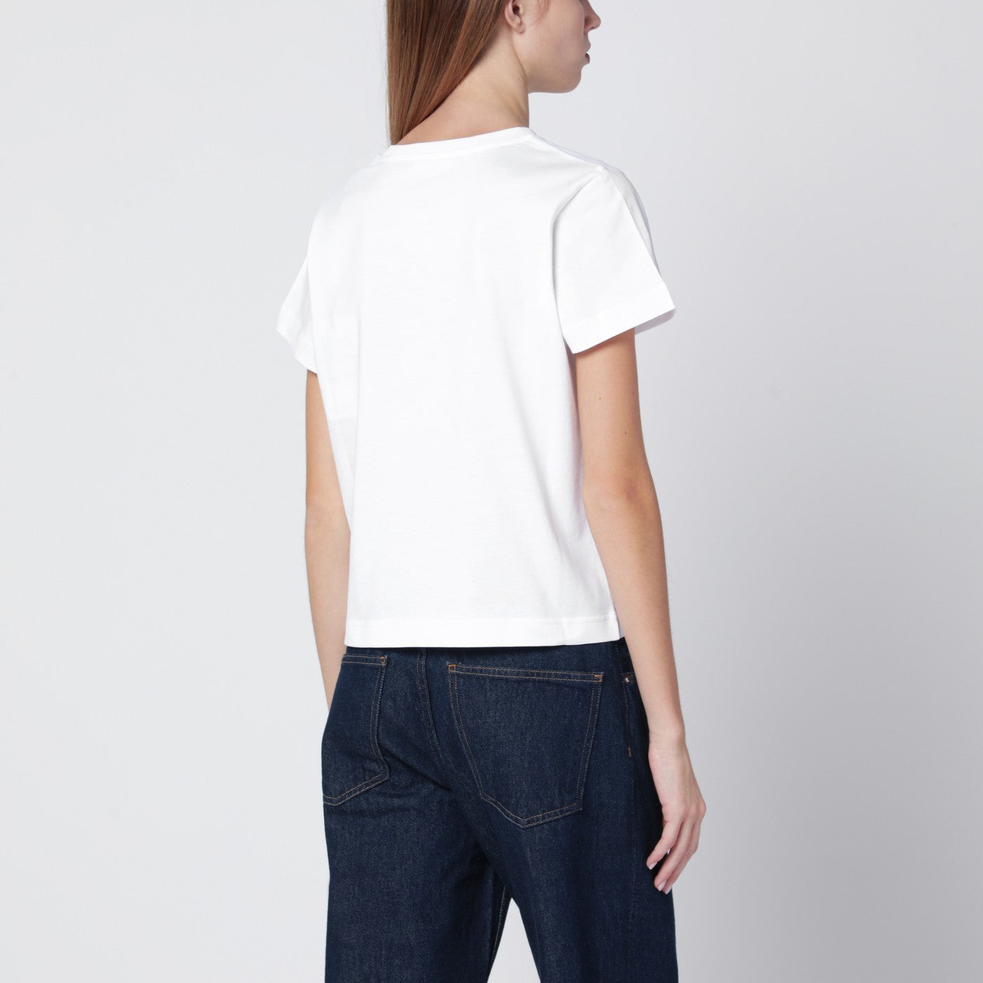 T-shirt bianca in cotone con cuore ricamato