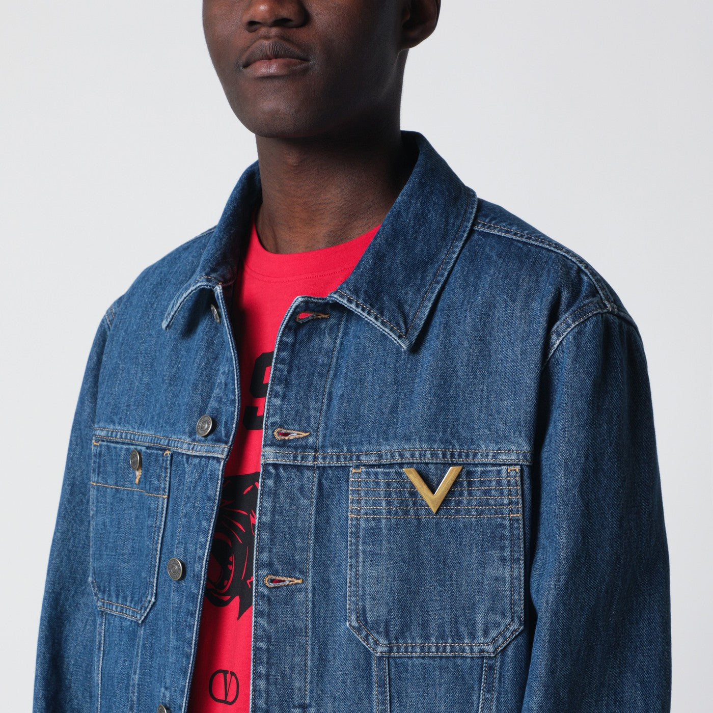 Giacca blu in denim con Vgold