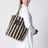 Striped shoulder bag in raffia and leather