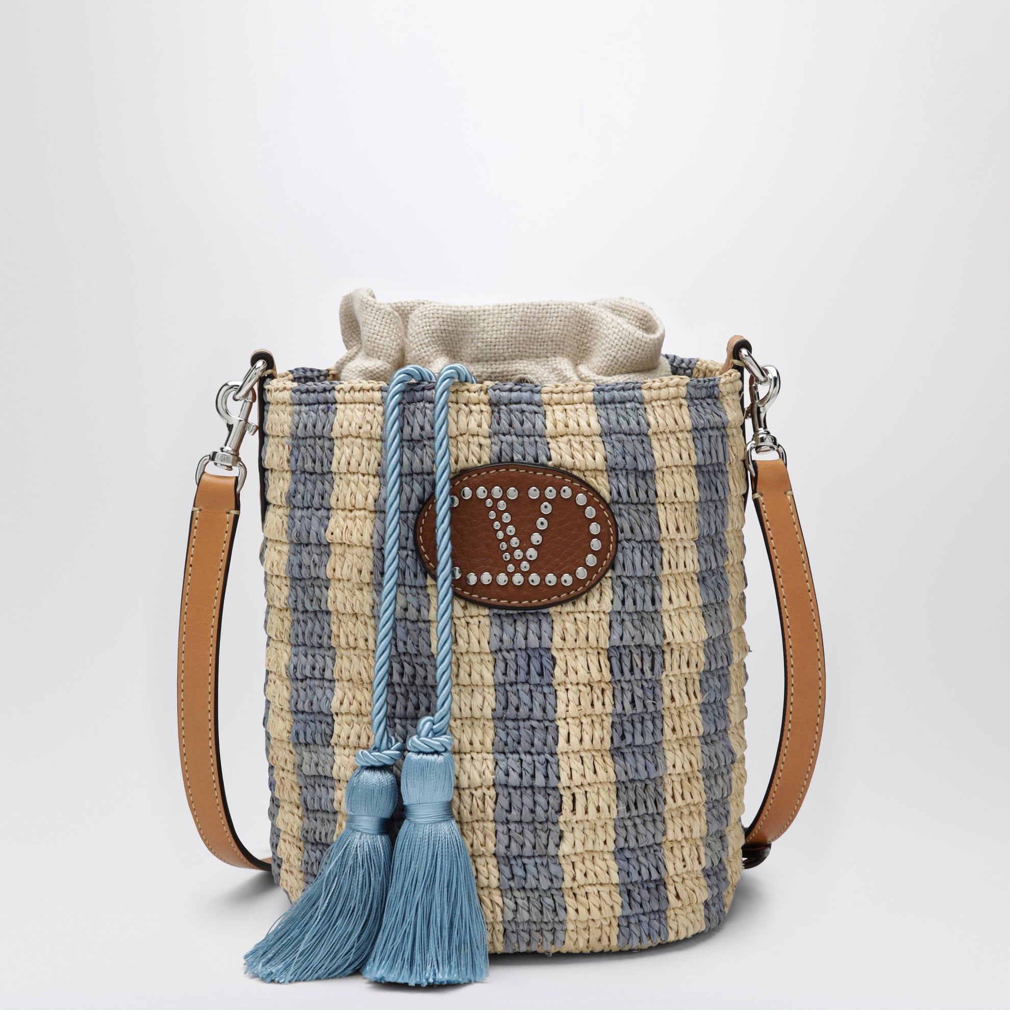 Petit sac seau en raphia à rayures beige et bleu clair