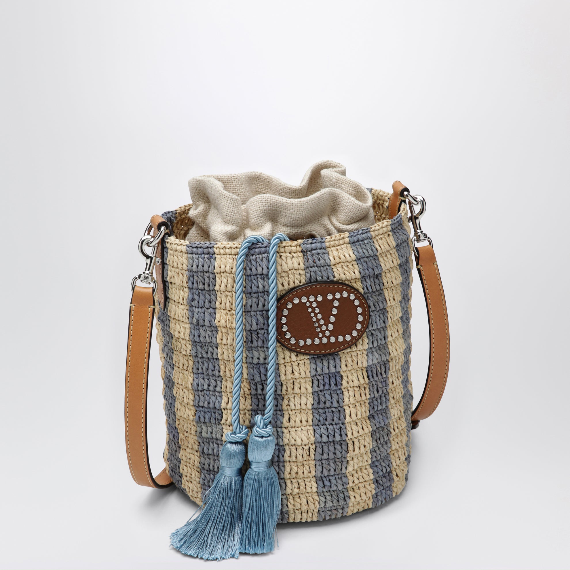 Petit sac seau en raphia à rayures beige et bleu clair