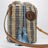 Petit sac seau en raphia à rayures beige et bleu clair