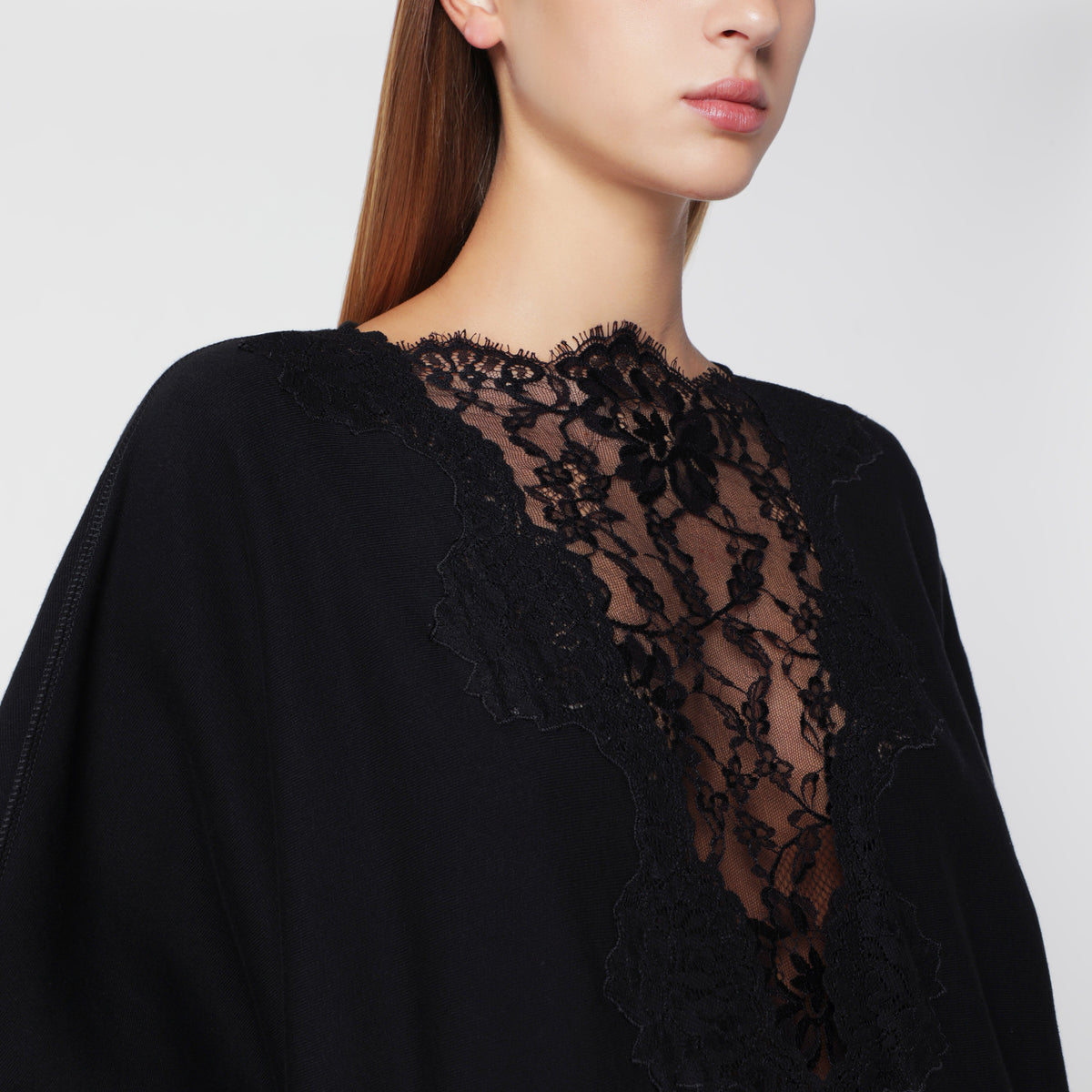 Black sweatshirt-style mini dress with lace inserts