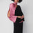 Robe longue noire en soie avec drapé rose