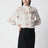Vanillefarbene Seidenbluse mit Logoprint