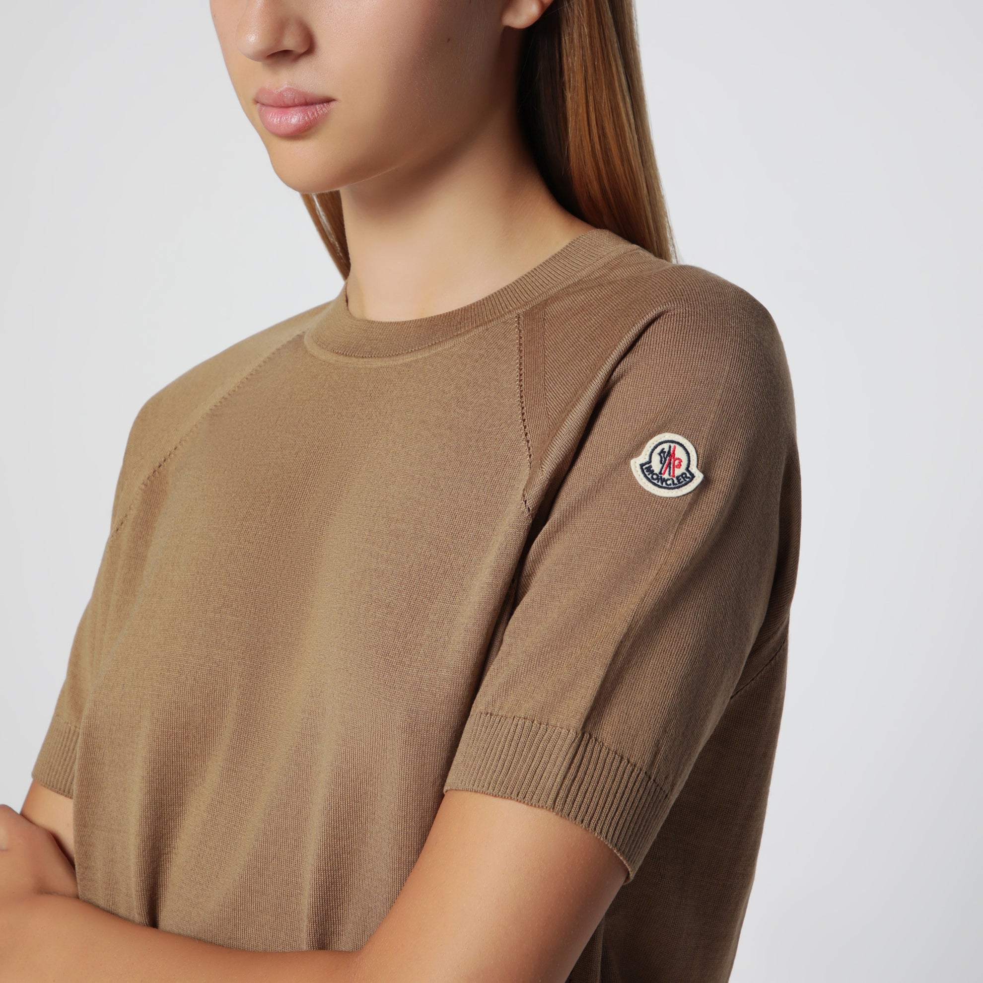Beige wool sweater with logo patch
