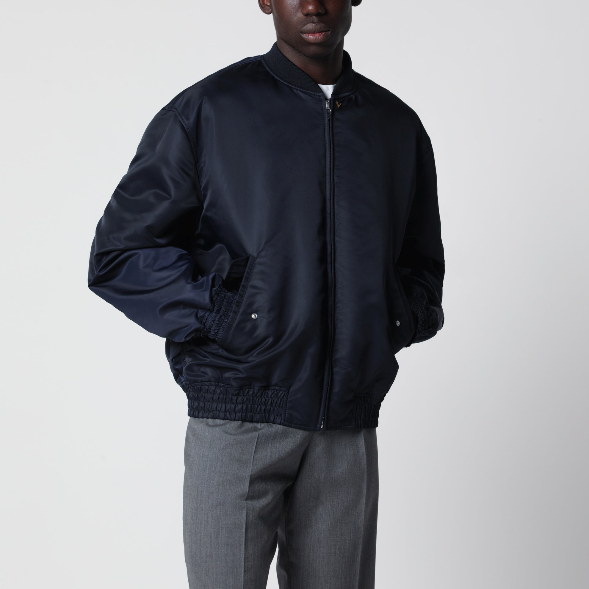 Shiny navy blue zip-up bomber jacket with Vlogo