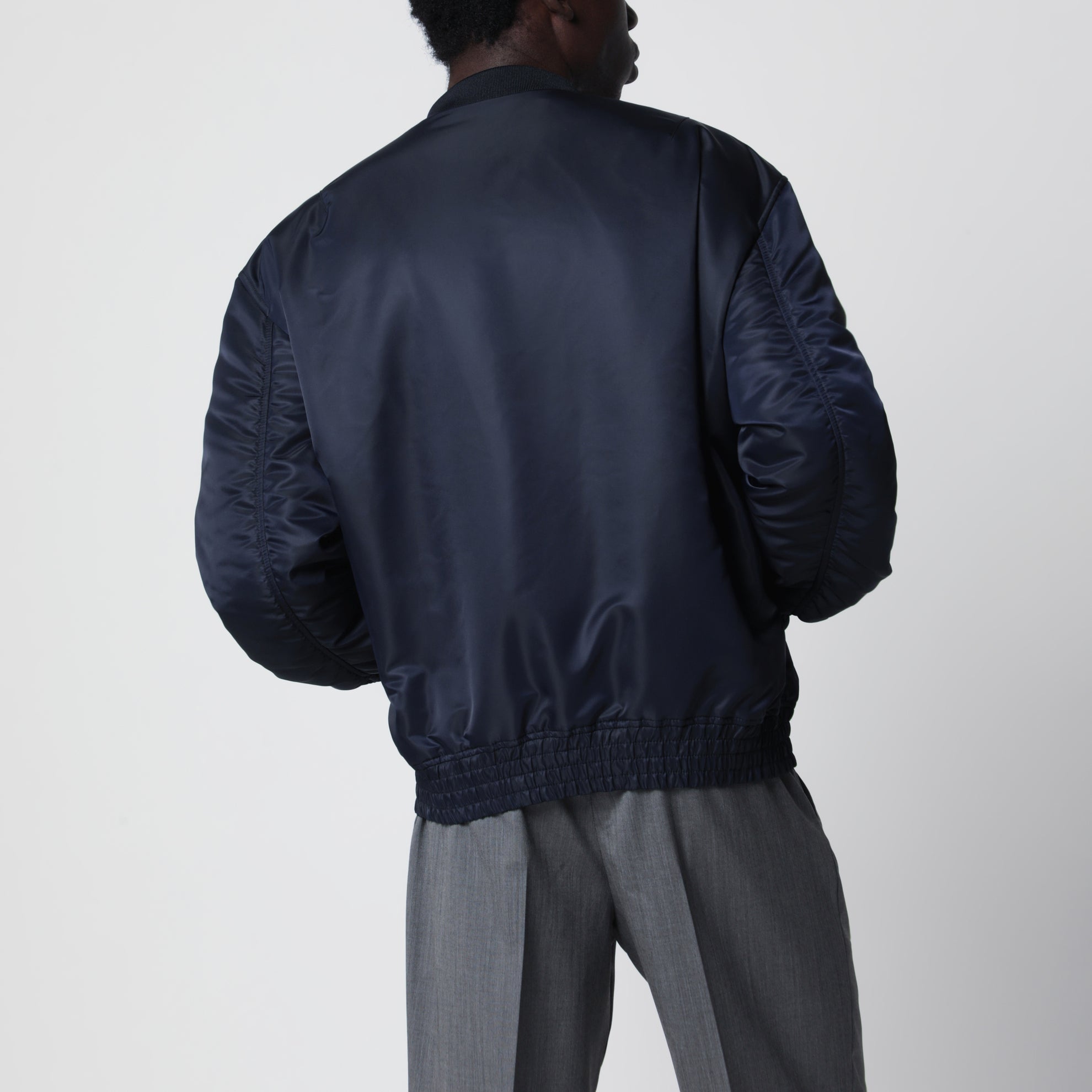 Shiny navy blue zip-up bomber jacket with Vlogo