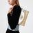 Goldfarbene VLogo Signature Tasche mit Metallic-Finish