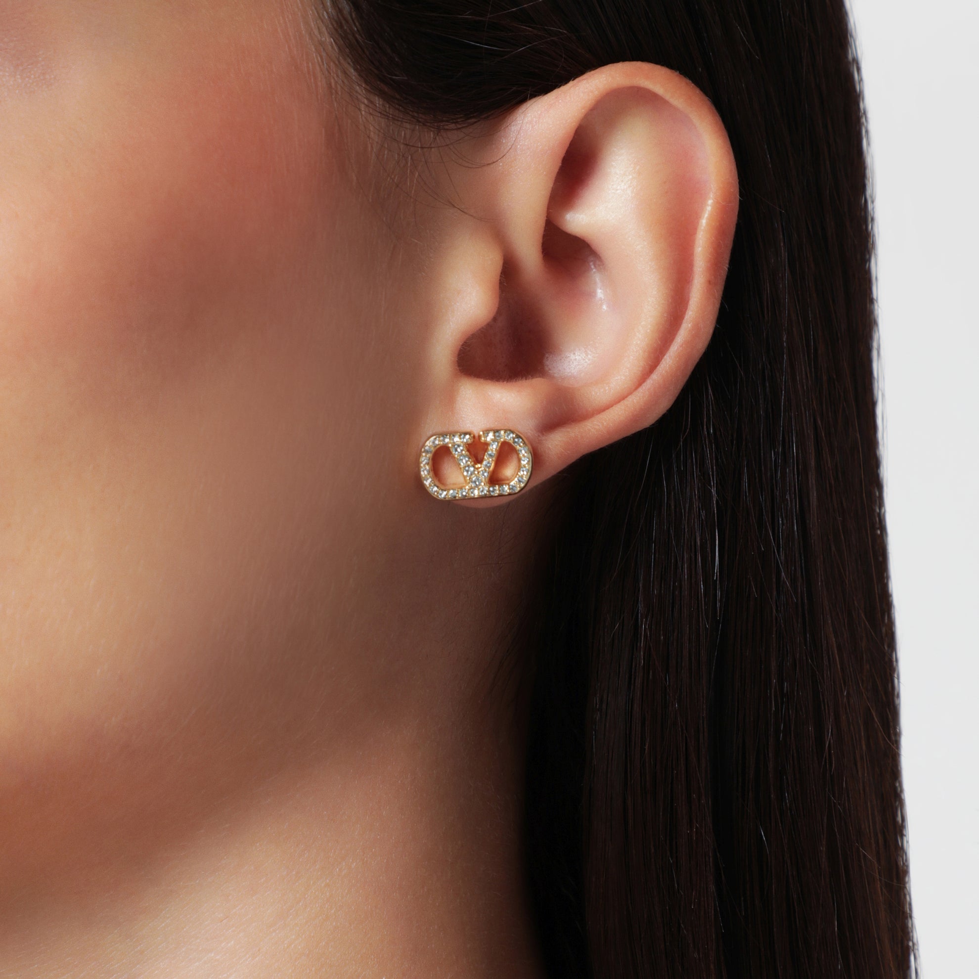 Boucles d’oreilles VLogo Signature dorées avec cristaux