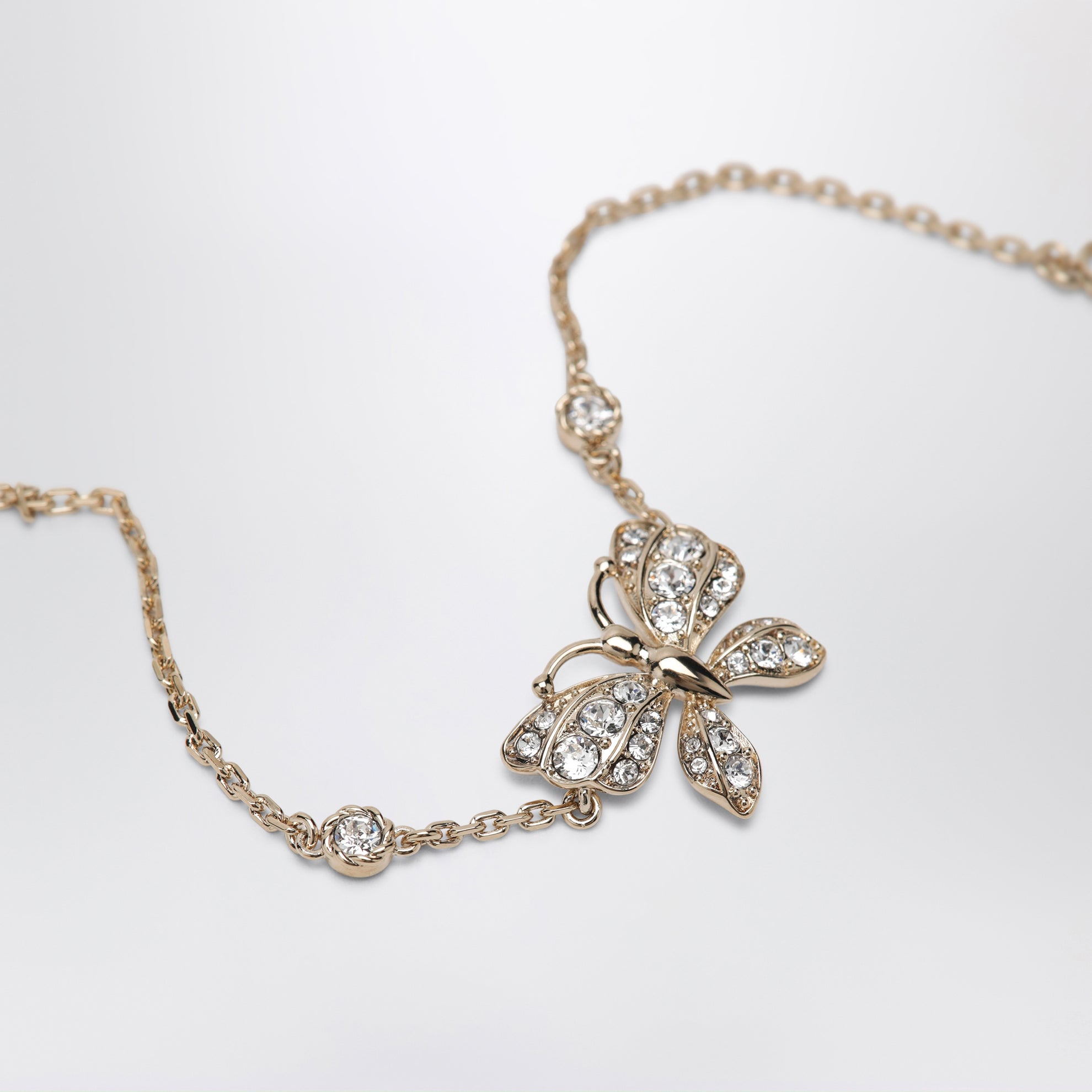 Bracelet Flutterby doré en métal et cristaux
