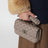 Mini Rockstud Spike top-handle bag in powder pink leather